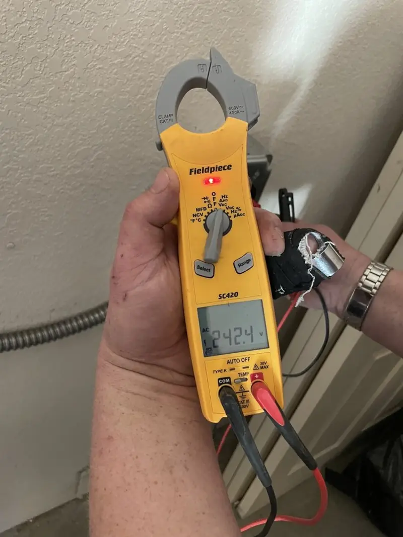 Voltage testing with clamp meter during Electrical Installation Services in St. Augustine